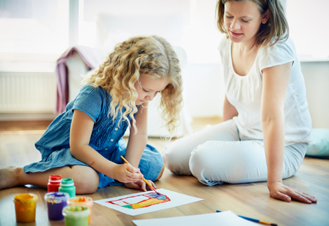 Therapist coaching parents during an ABA session