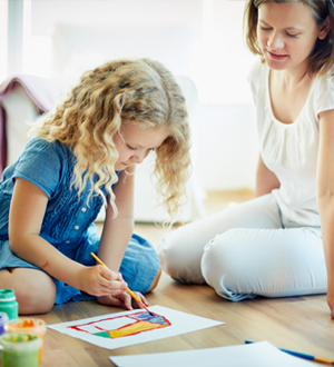 ABA therapist helping a child build confidence and communication skills